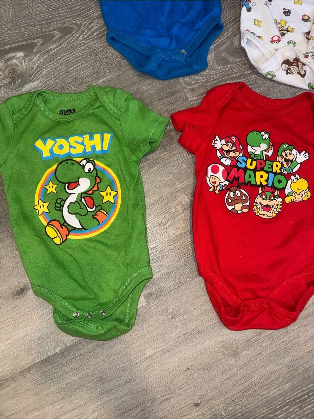 Super Mario baby onesies